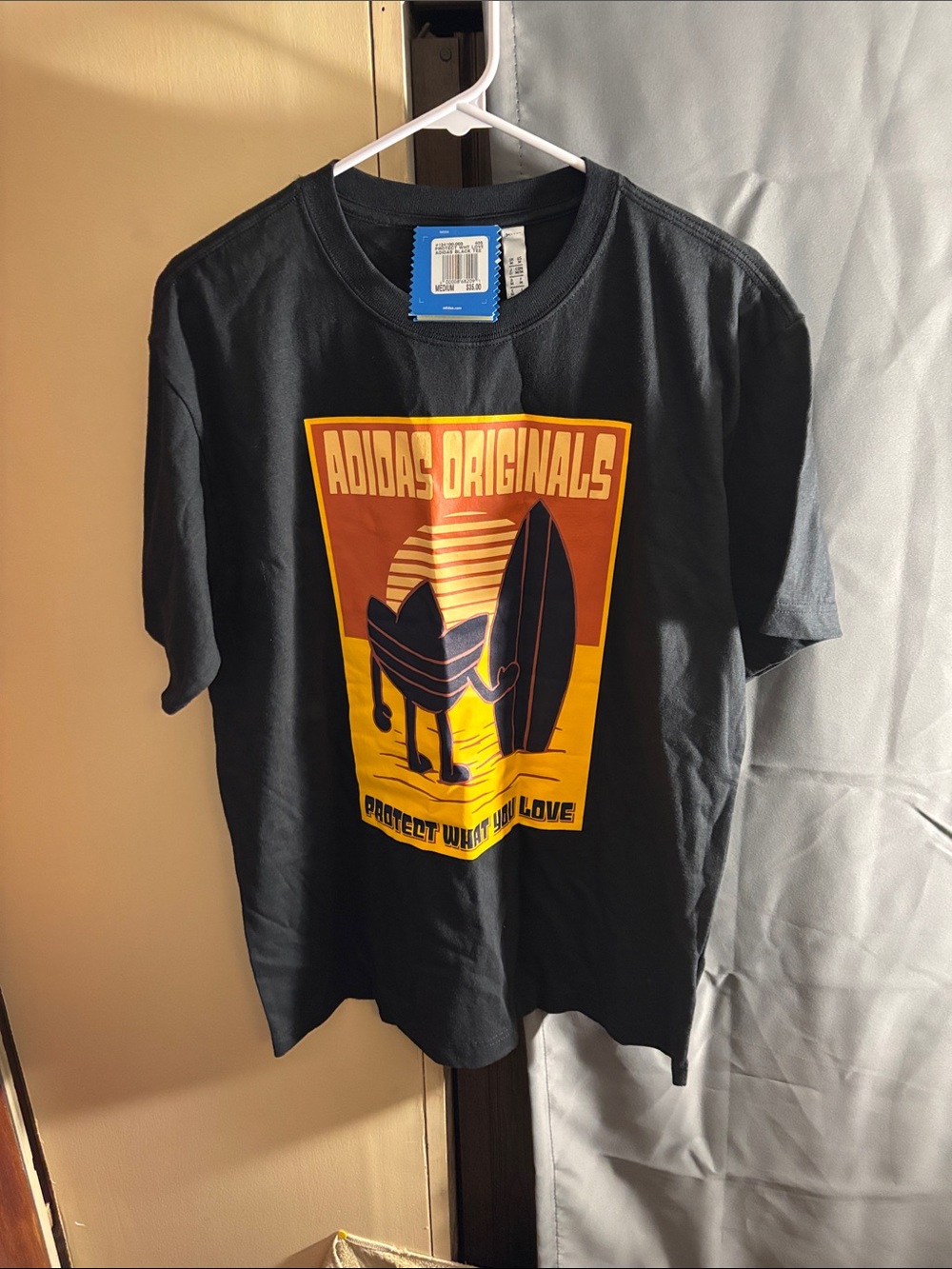 adidas Originals Black Tee with Orange & Yellow Surf Graphic